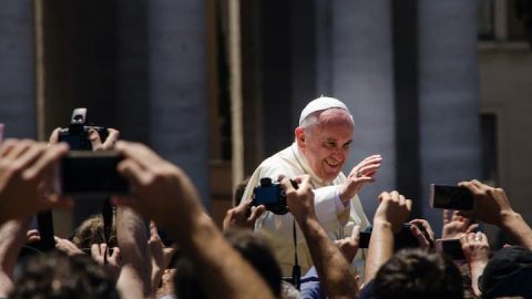 Pope Francis greets crowds in St. Peter's square.